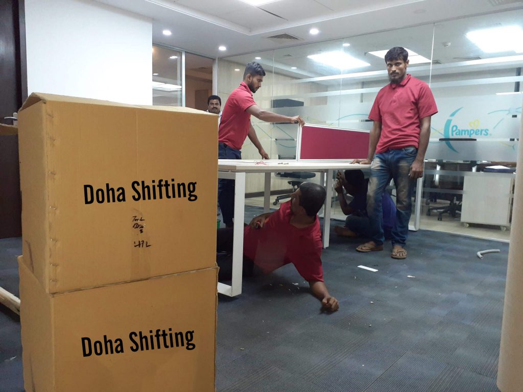 Three person are prepare office accessories for moving.